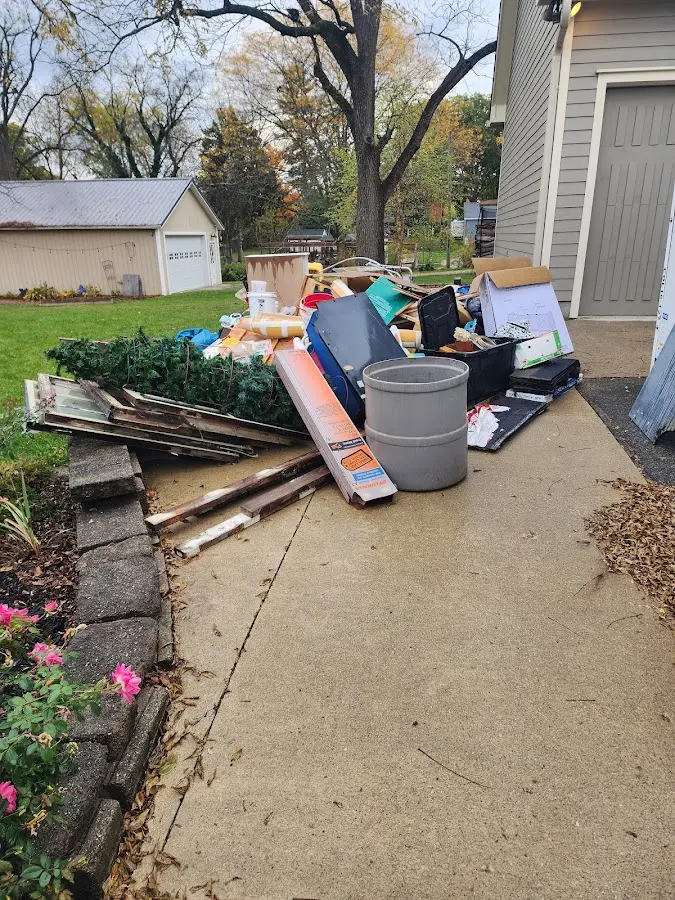 Dumpster being loaded with debris for Commercial Dumpster Rental in Washington
